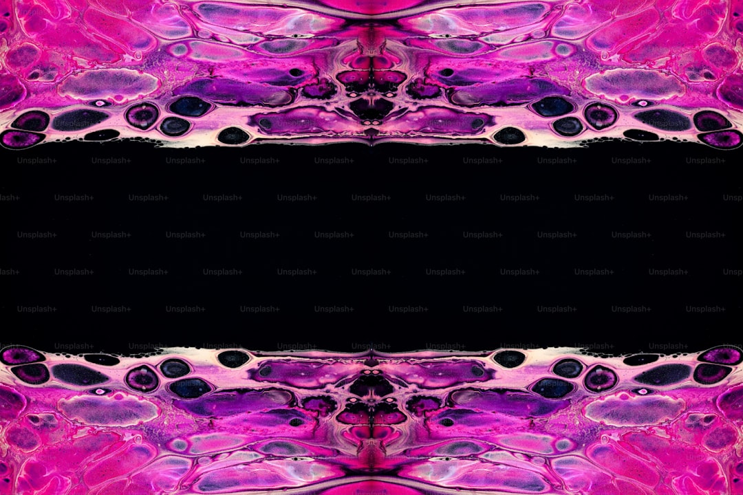 a black background with a pink and purple pattern