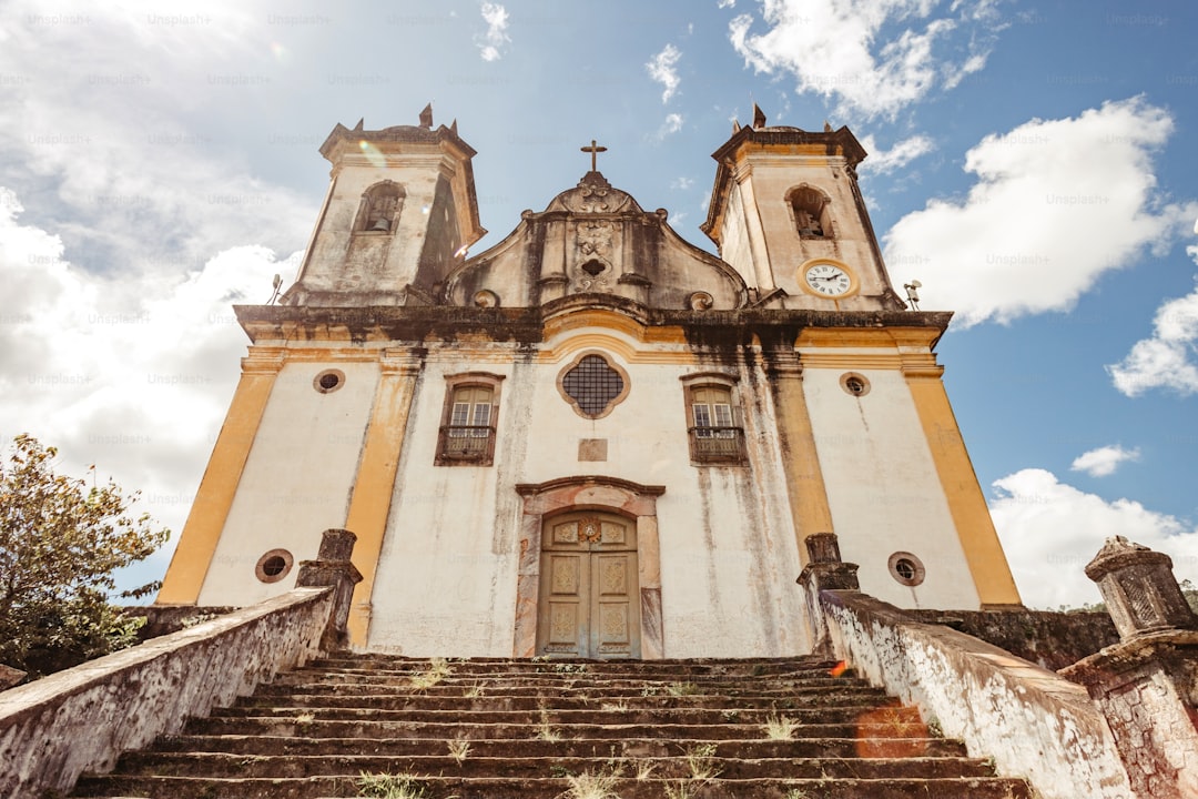 a church with a steeple and a clock on it