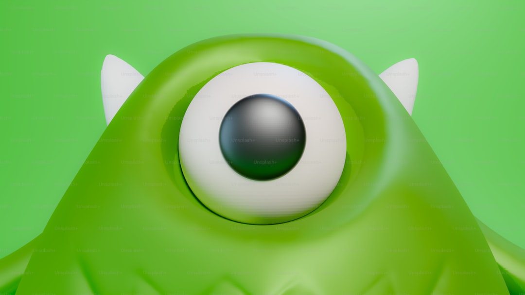 A close up of a green monster with big eyes