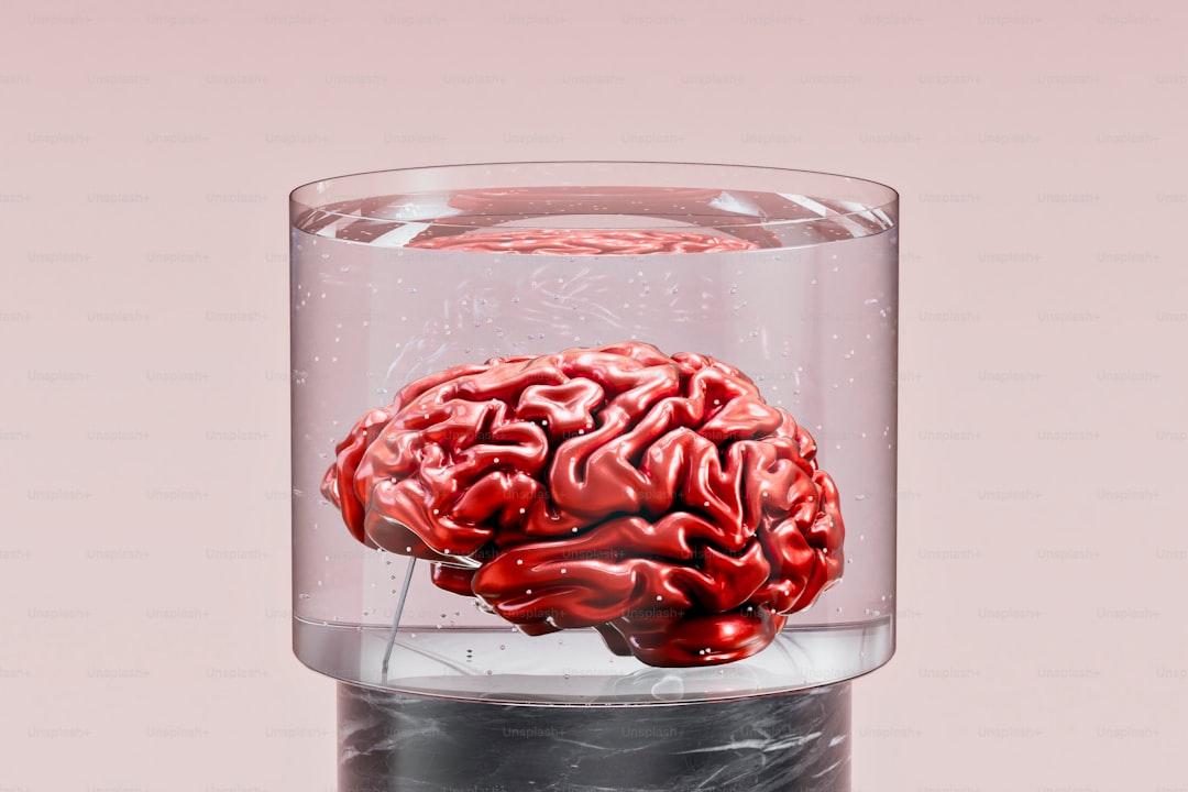 A glass with a red brain inside of it