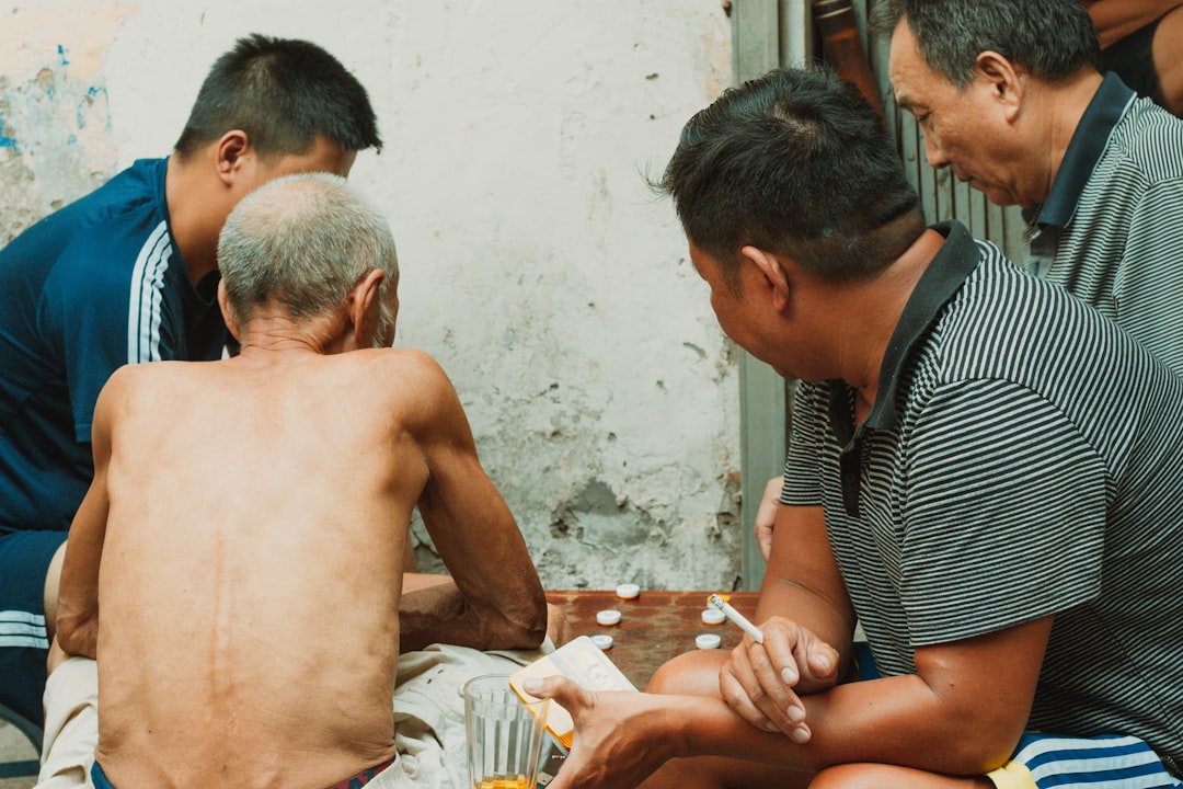 a group of men sitting around a table