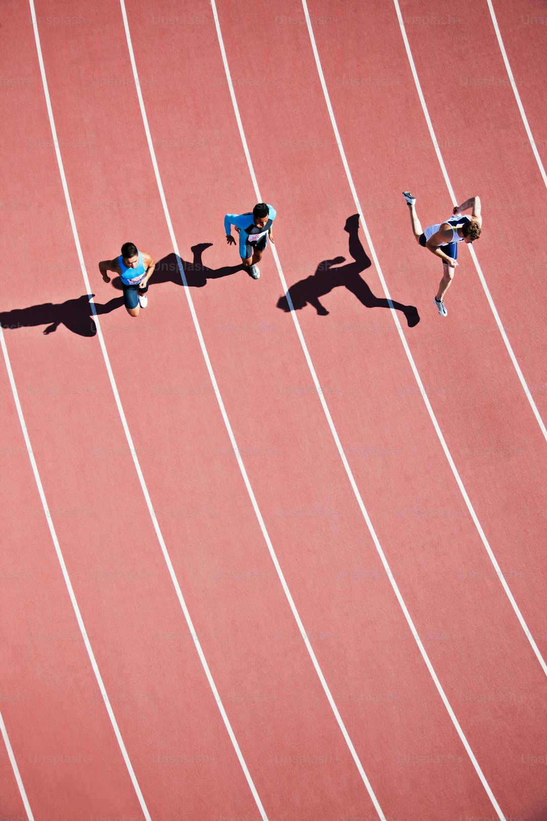 a group of people running on a track