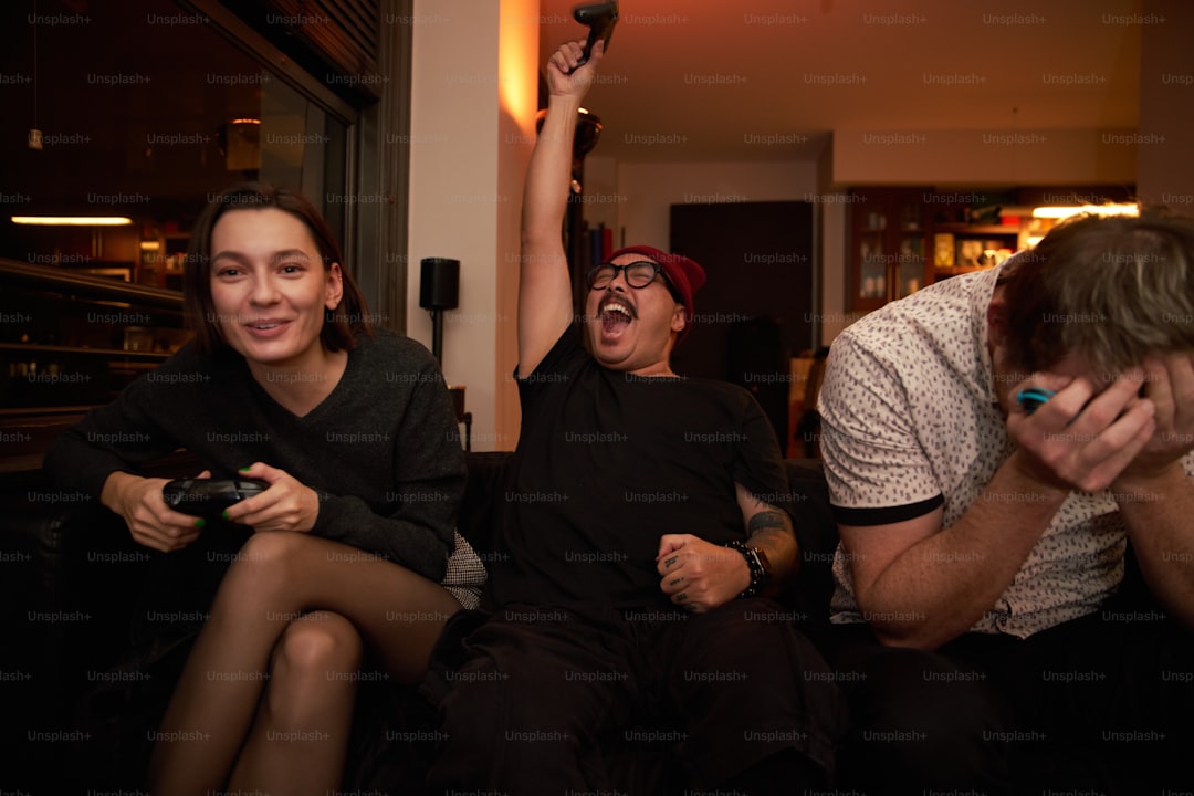 a group of people sitting on top of a couch