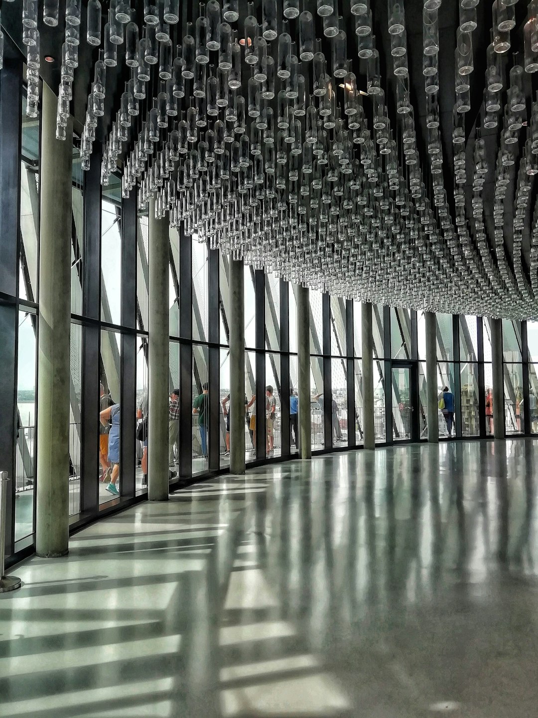 a group of people standing inside of a building