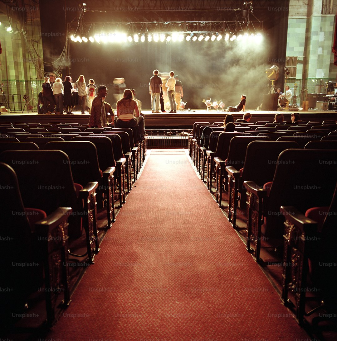 a group of people standing on top of a stage