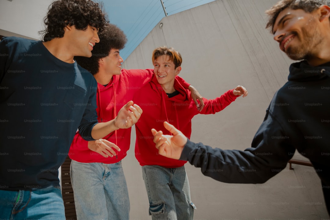 a group of young men standing next to each other