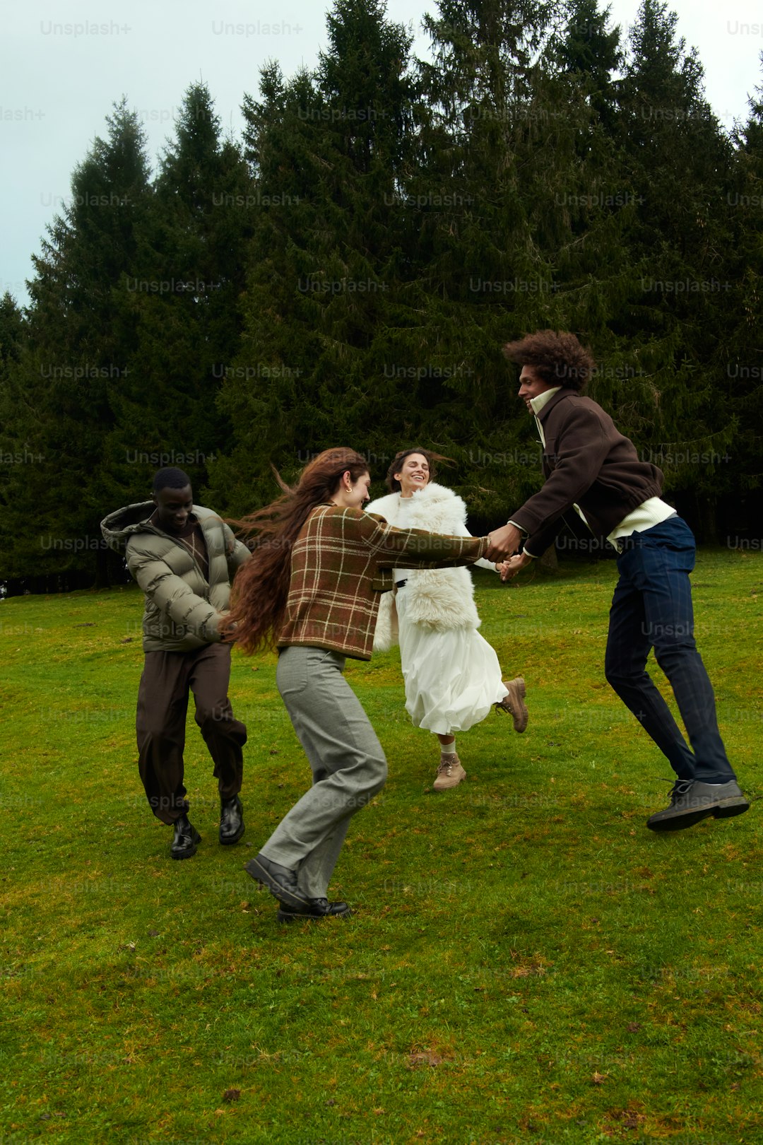 A group of young people playing a game of frisbee