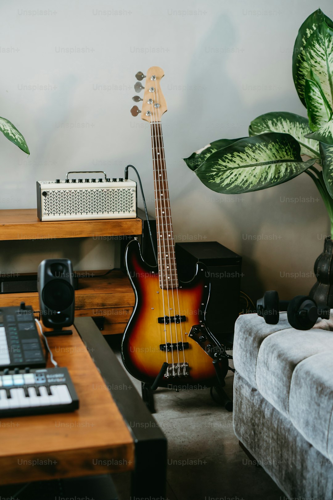 a guitar sitting on top of a table next to a keyboard