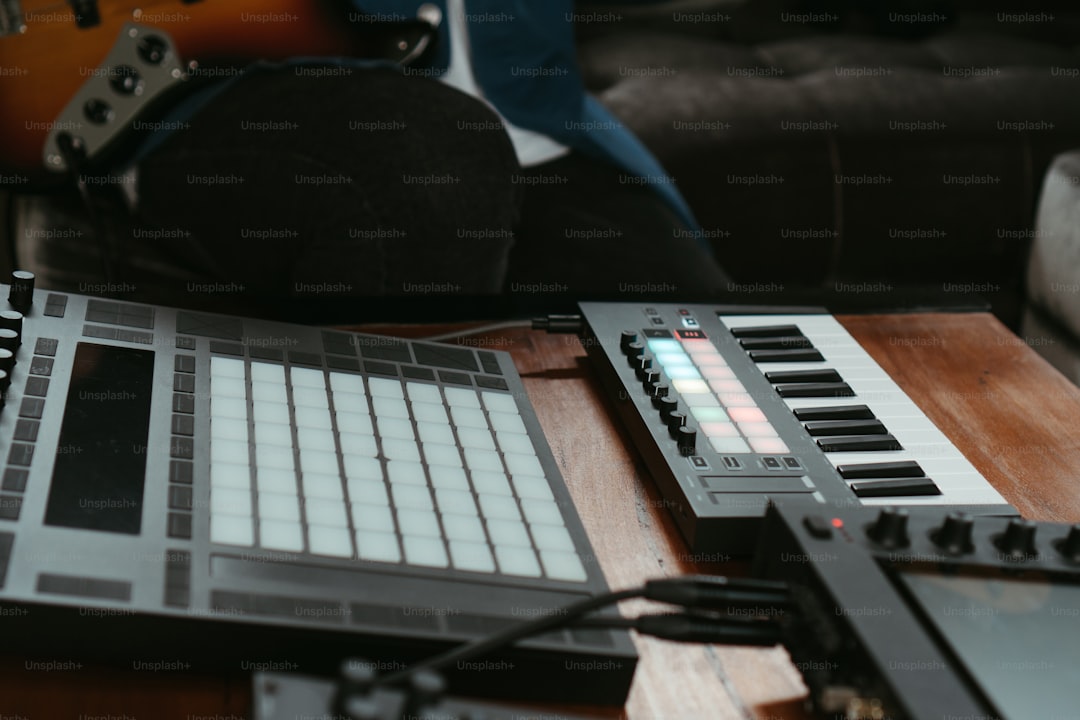 a keyboard sitting on top of a wooden table