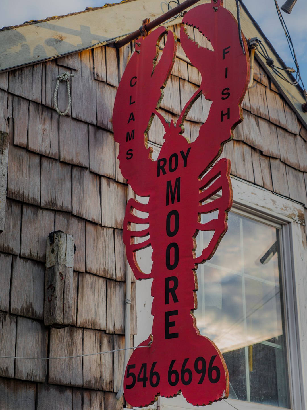 a large lobster sign on the side of a building