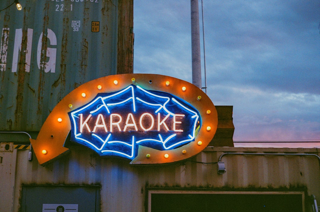 a large neon sign on the side of a building