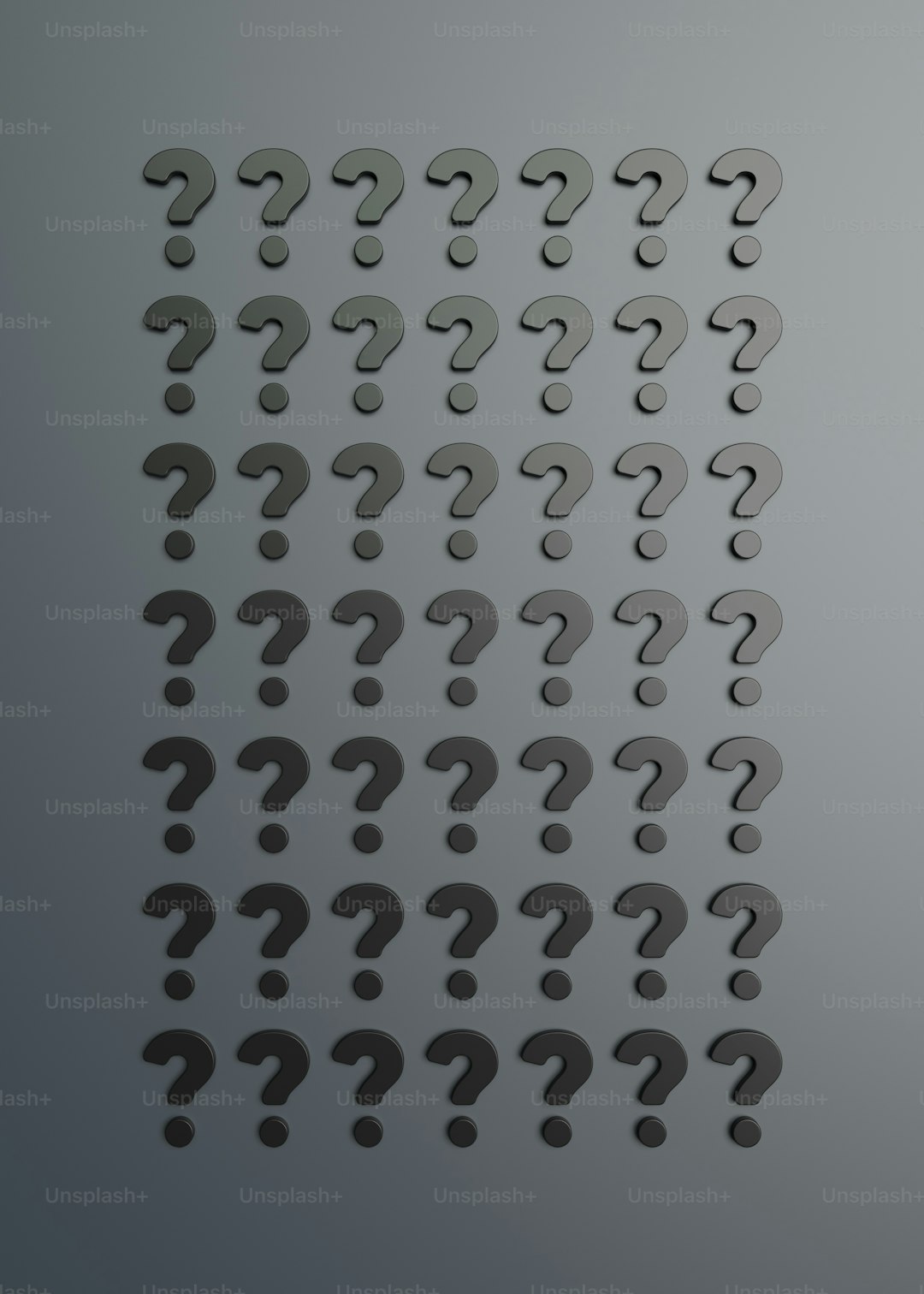 a number of question marks on a gray background