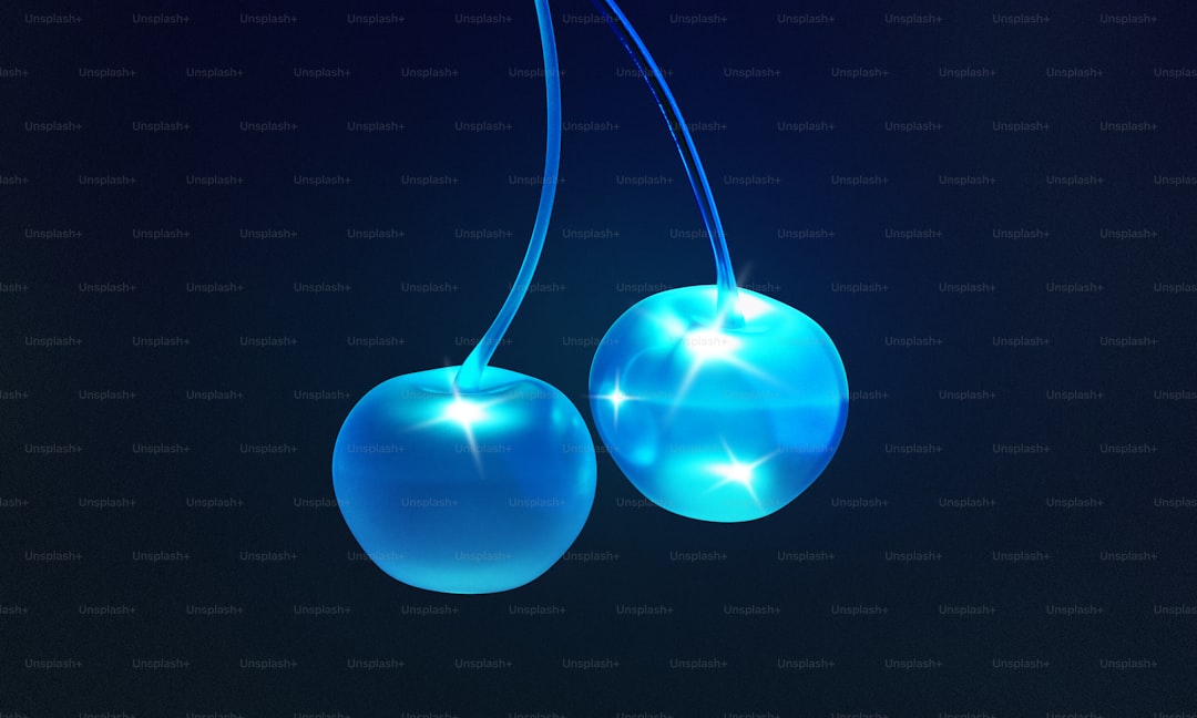 A pair of blue glowing cherries hanging from a string