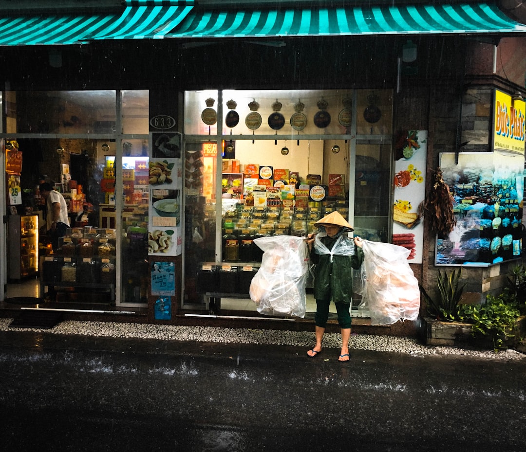 a person carrying bags on the street