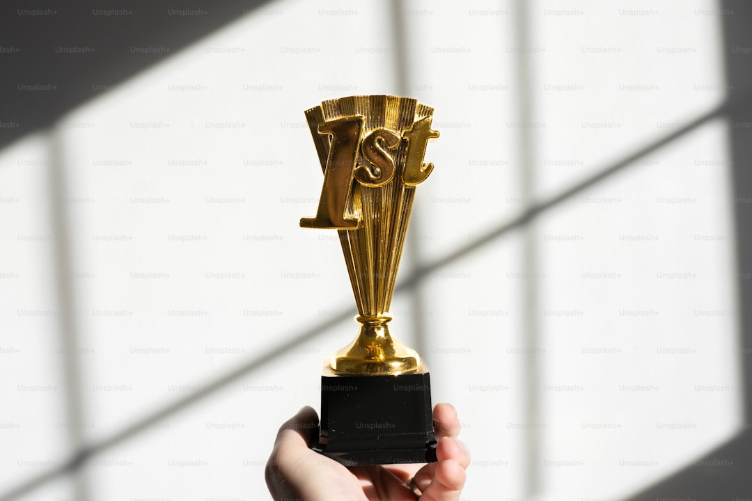 a person holding a trophy in their hand