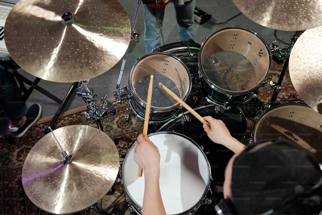 a person is playing drums in a room