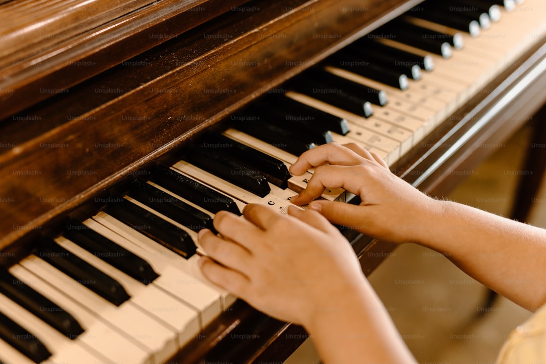 a person playing a piano with their hands