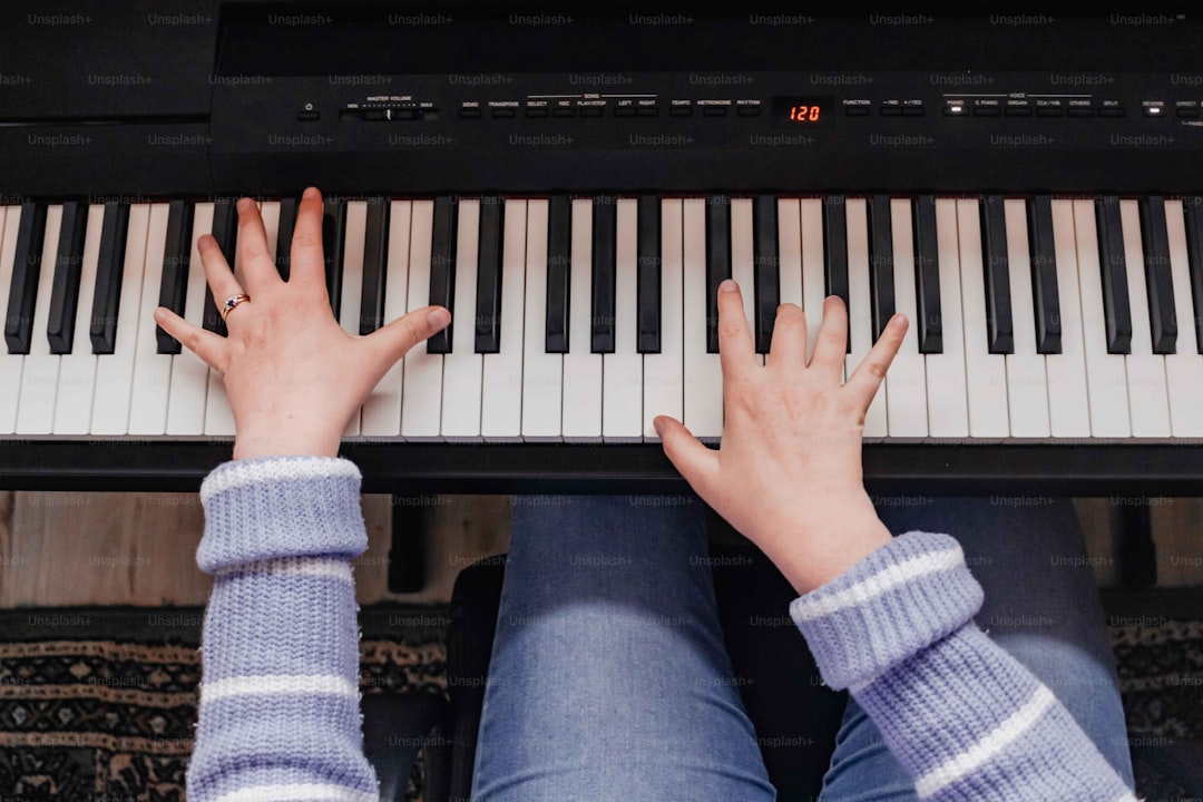 a person playing a piano with their hands