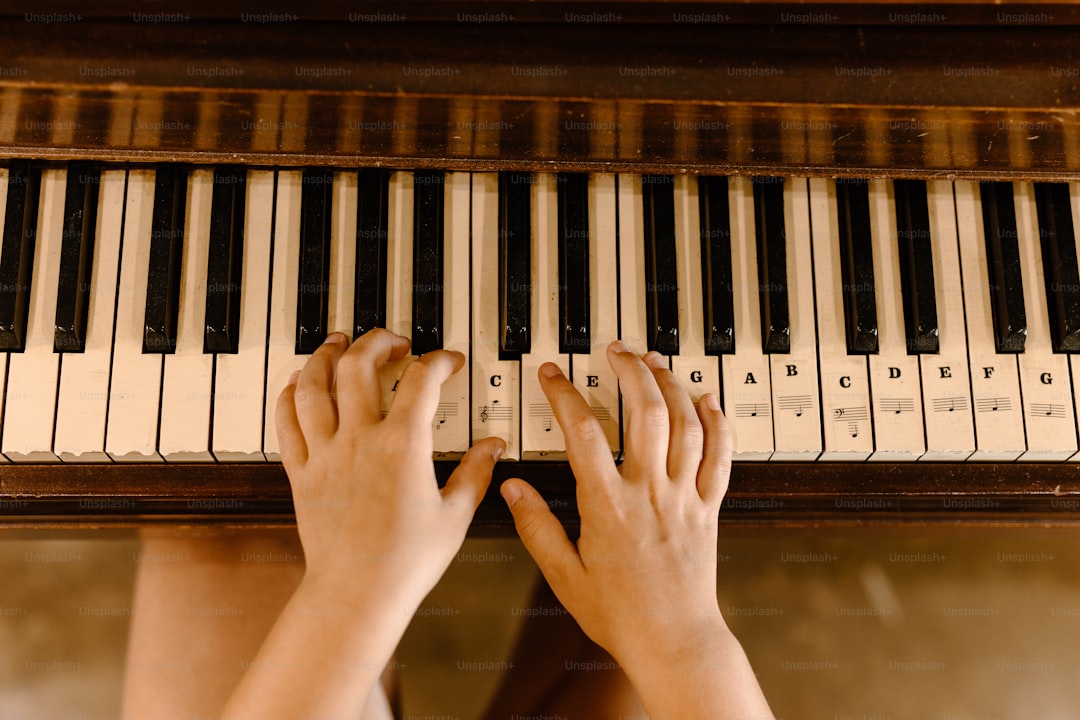 a person playing a piano with their hands