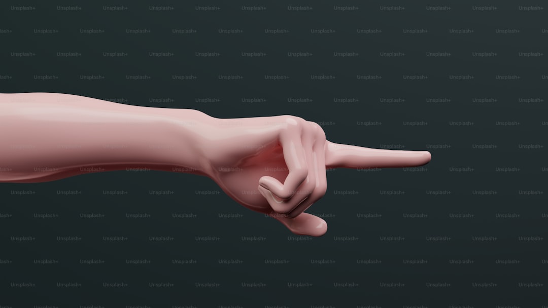 A pink hand pointing at something on a black background