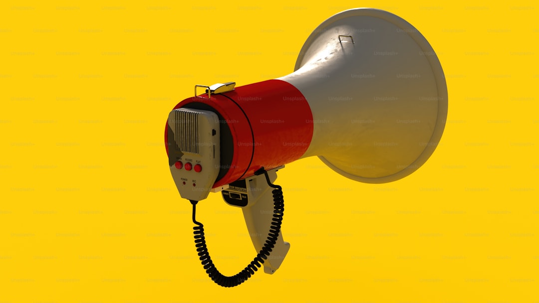 a red and white megaphone on a yellow background