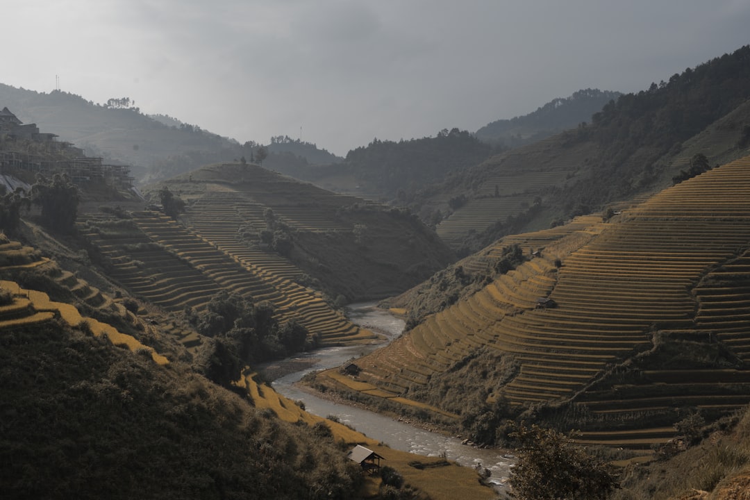 a river running through a valley surrounded by mountains