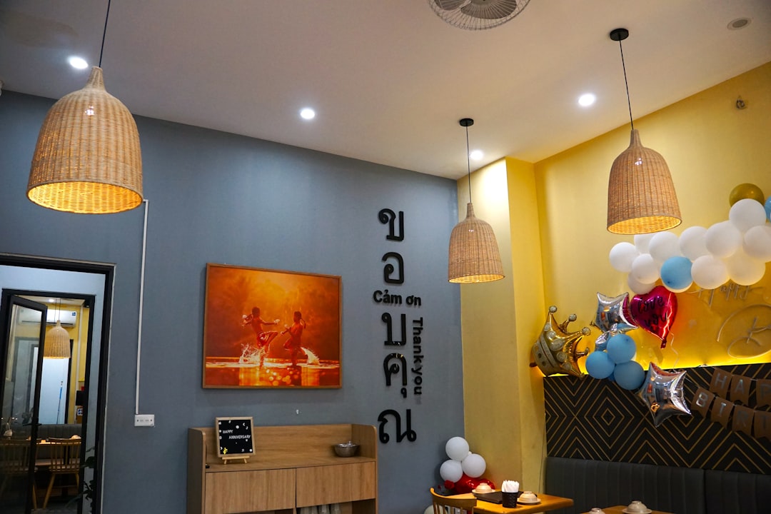 A room filled with furniture and balloons hanging from the ceiling