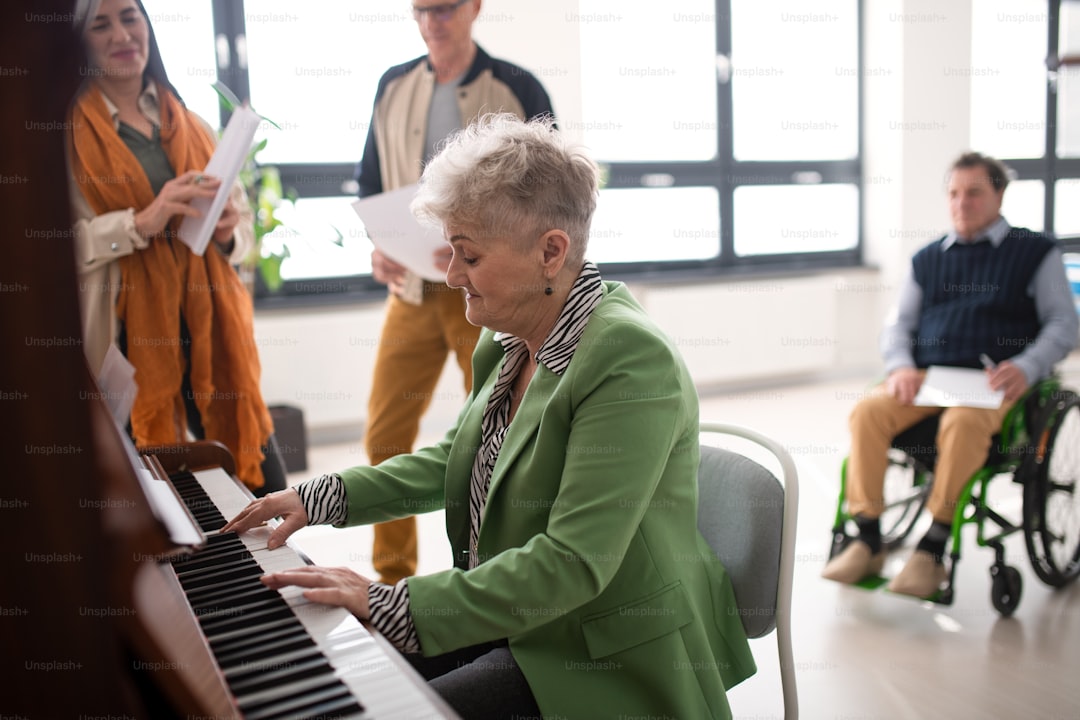 A senior woman playing at piano in choir rehearsal.