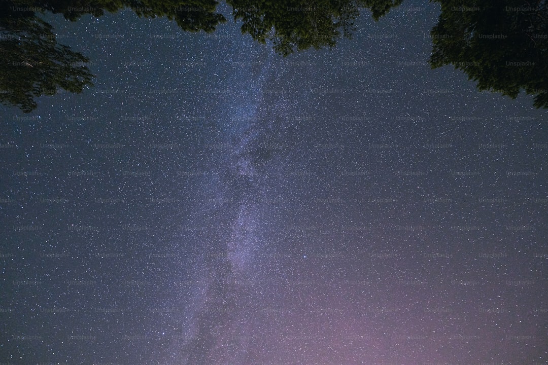 a view of the night sky with the milky in the background