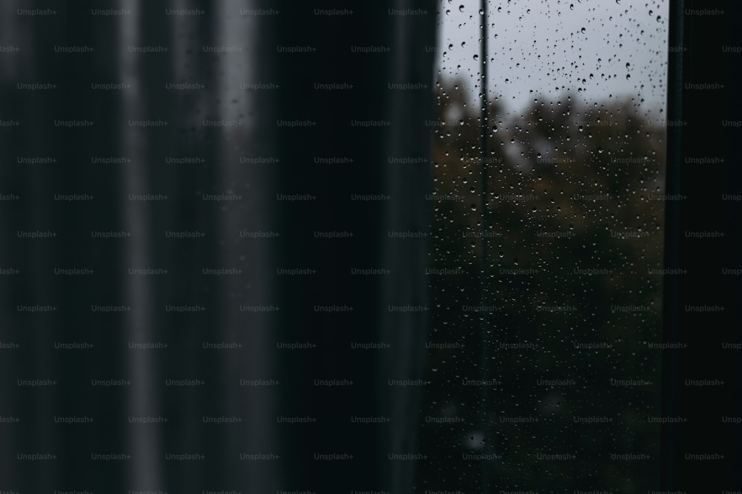 A window with rain drops on the glass