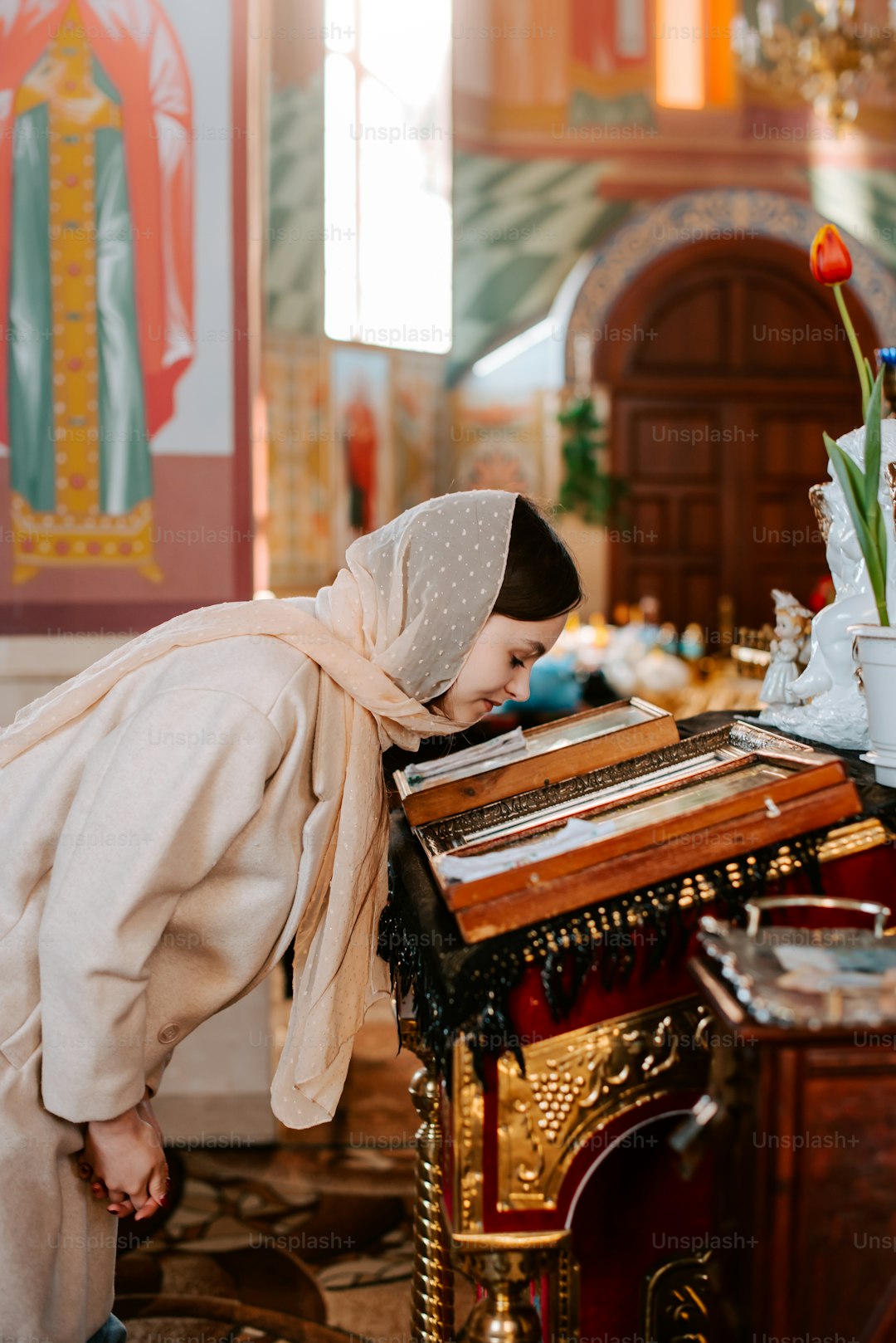 a woman in a white dress is playing a musical instrument