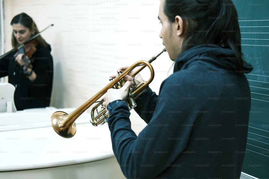 a woman playing a trumpet in front of a mirror