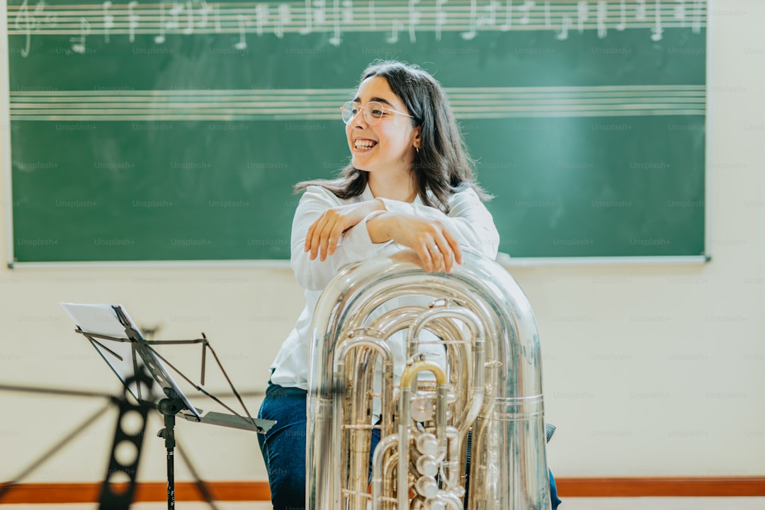 a woman standing in front of a musical instrument