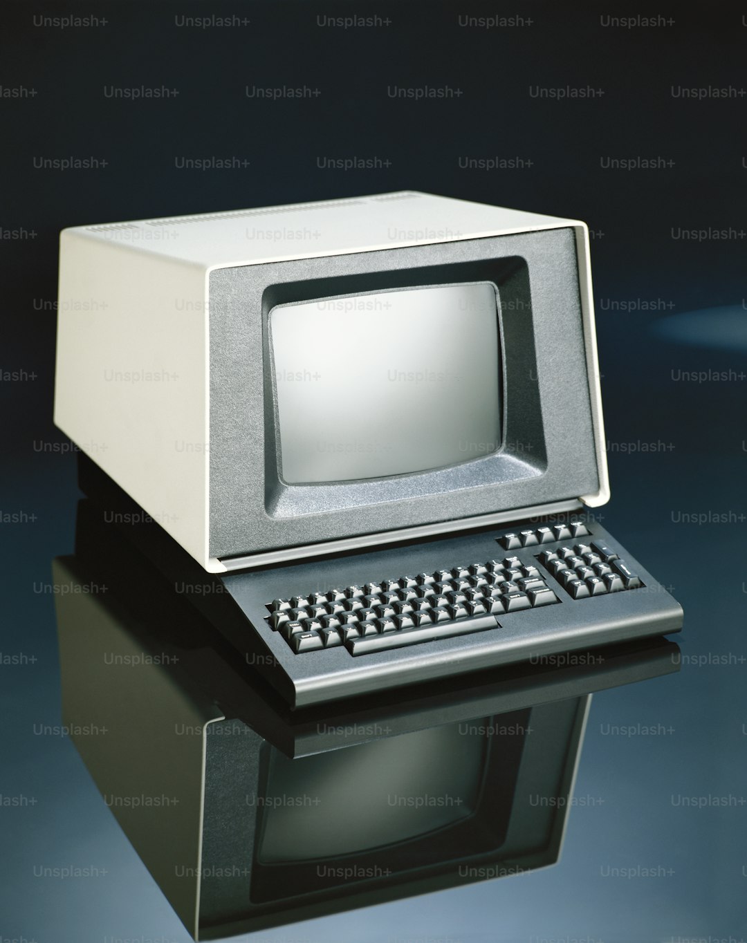 an old computer with a keyboard and mouse