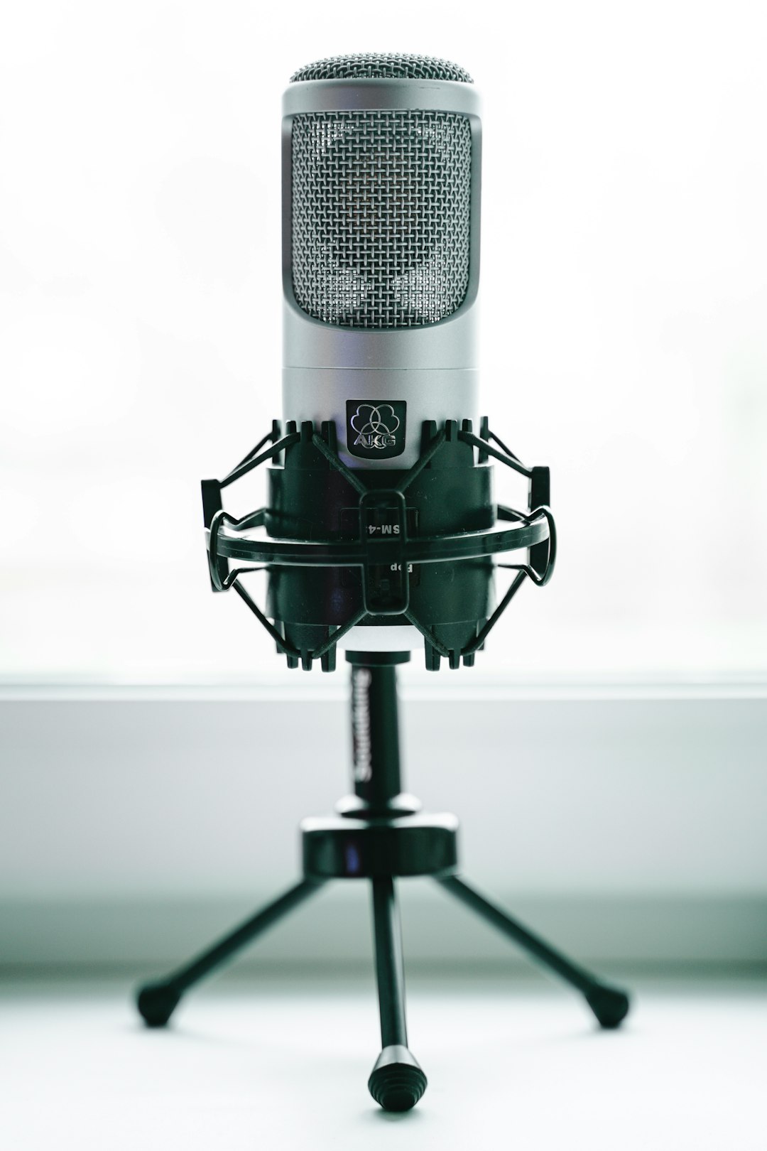 black and gray microphone with stand