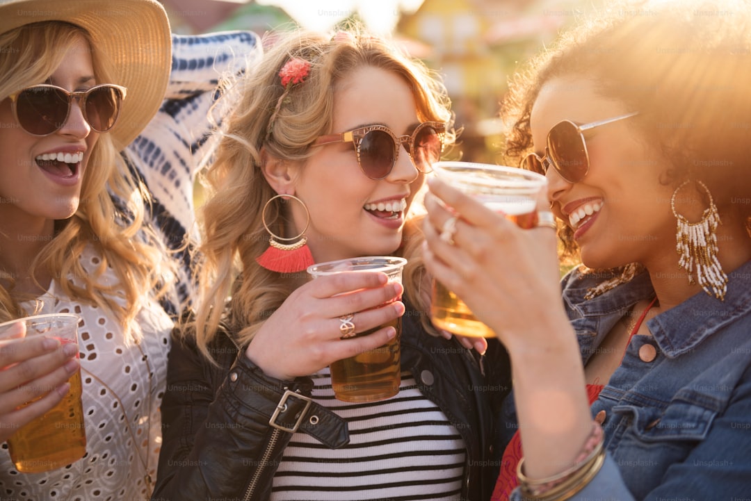 Girls drinking beer at the party