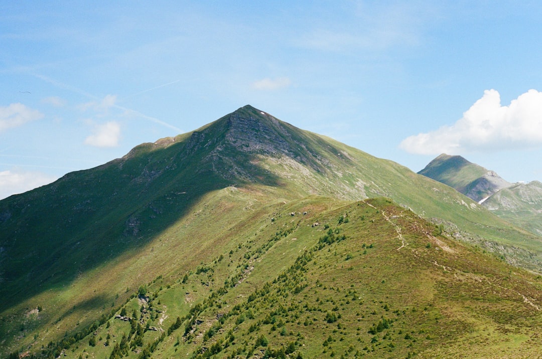 green and brown mountain under blue sky during daytime