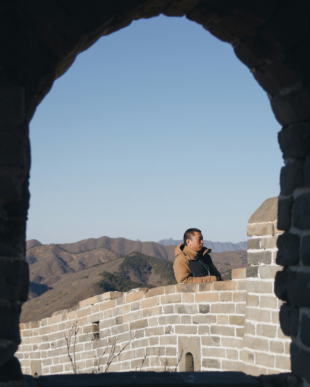 man leaning on wall