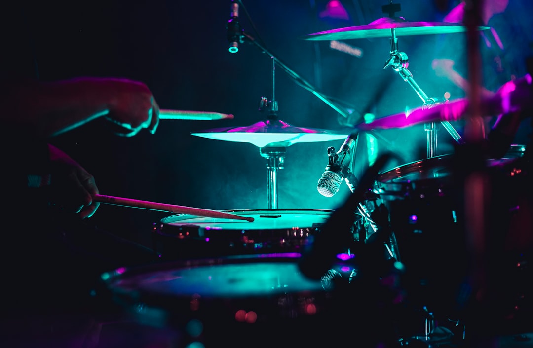 man playing drum set on stage