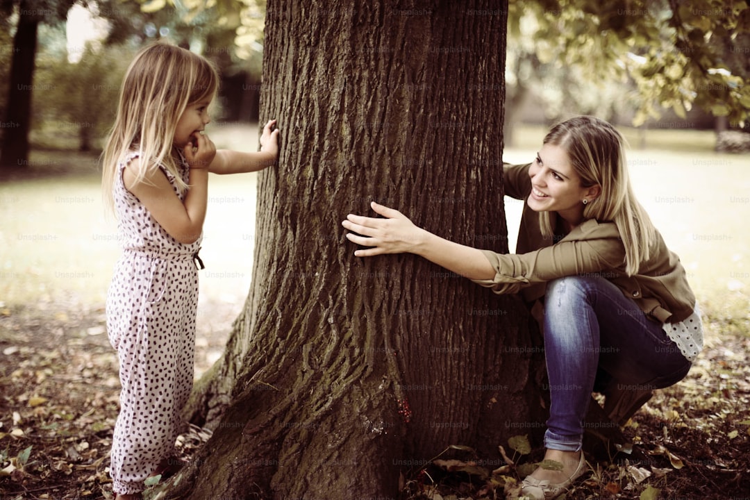 Mother and her daughter playing in the park.