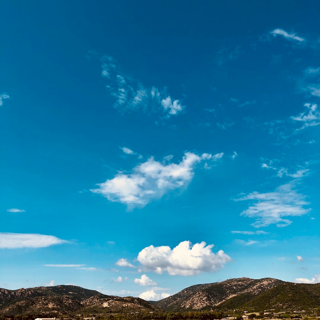 mountains under blue skies during daytime