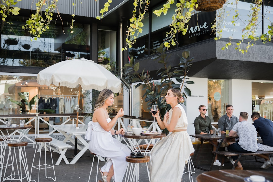 people sitting on chair near table during daytime