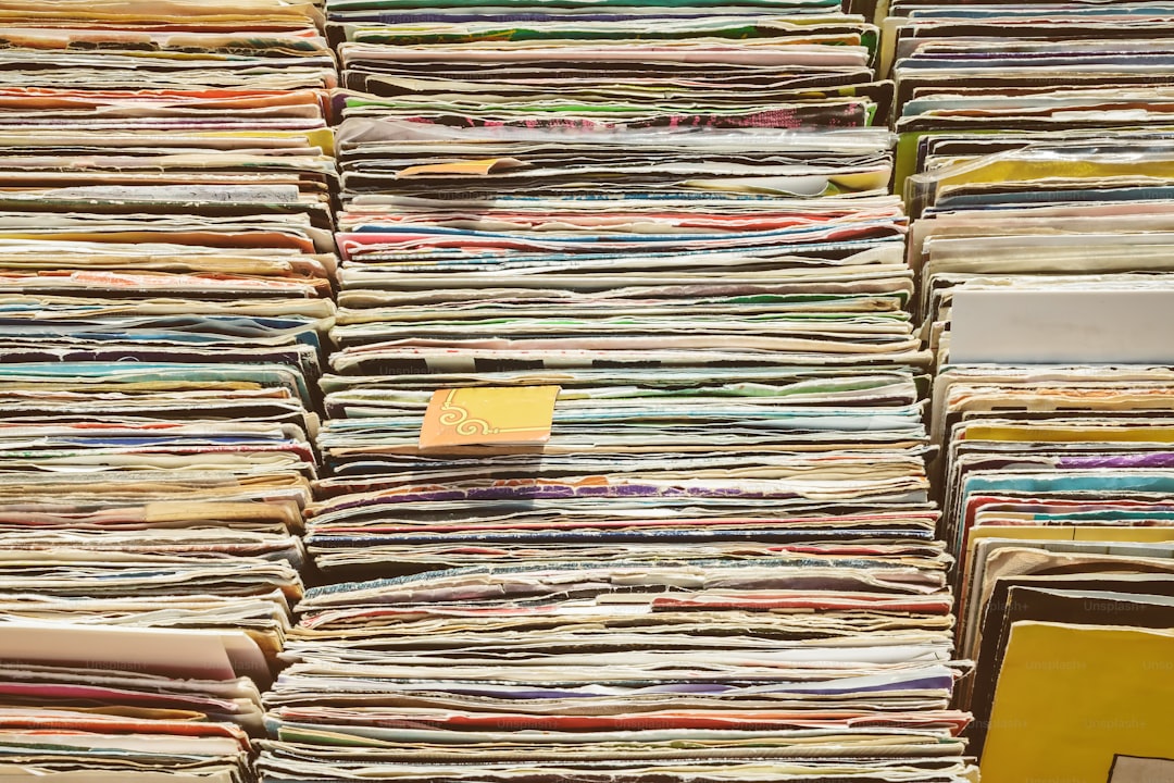 Retro styled image of boxes with vinyl turntable records on a flee market