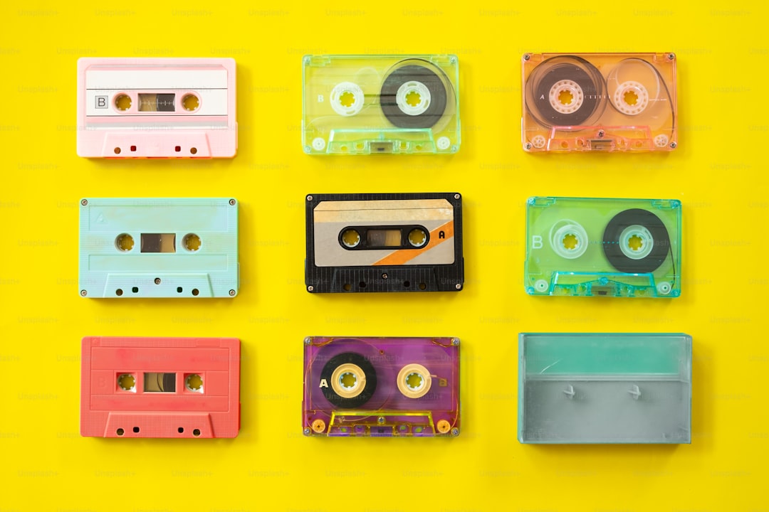 Set of vintage tape cassette recorder on yellow background, flat lay, top view. retro technology