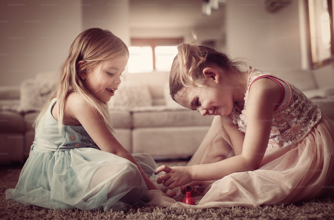 Two little girls nailed their nails at home.