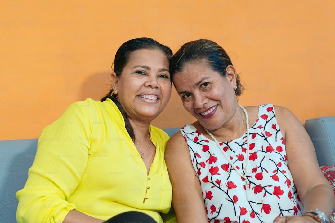 Two older sisters relaxing at home