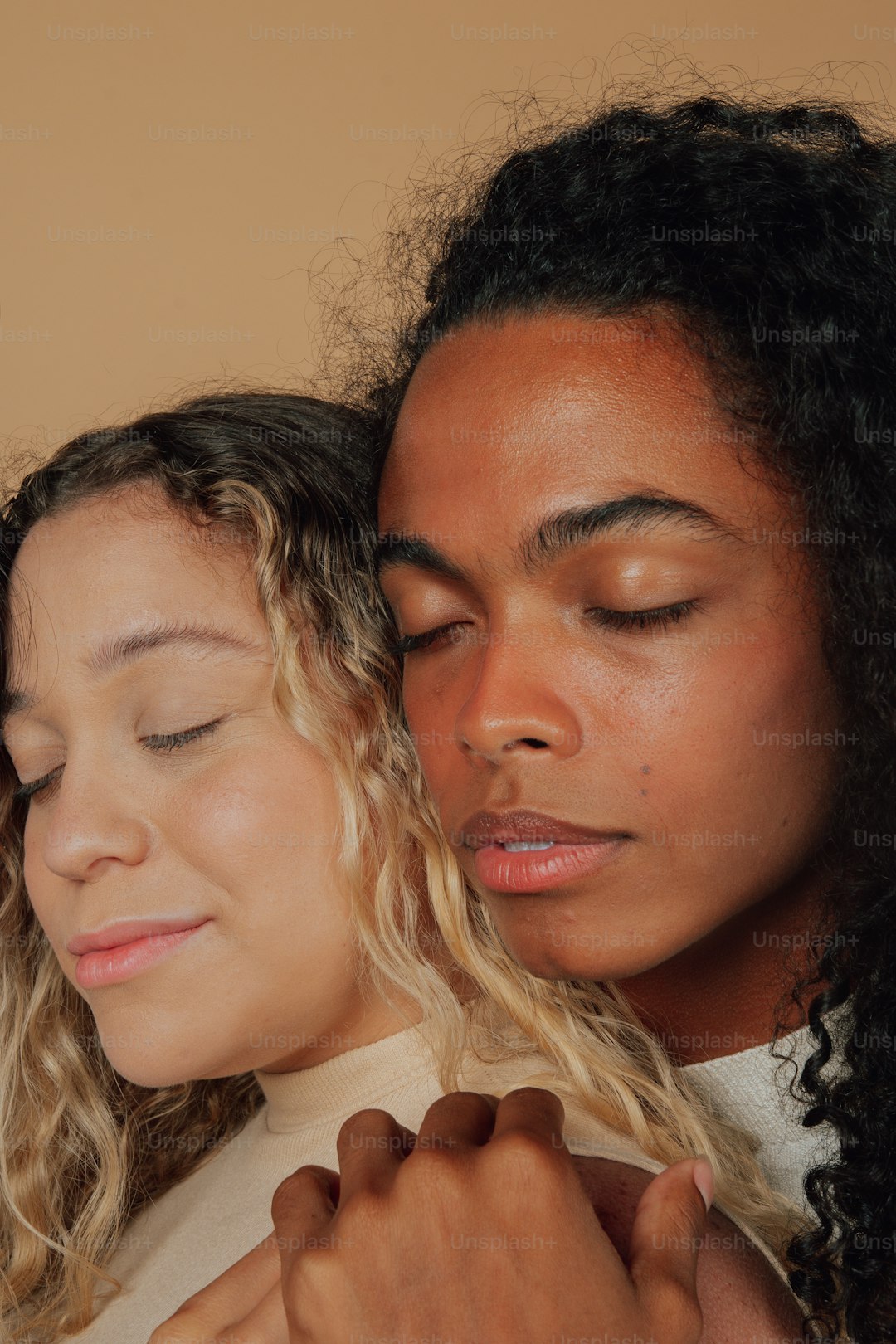 two women are looking at a cell phone