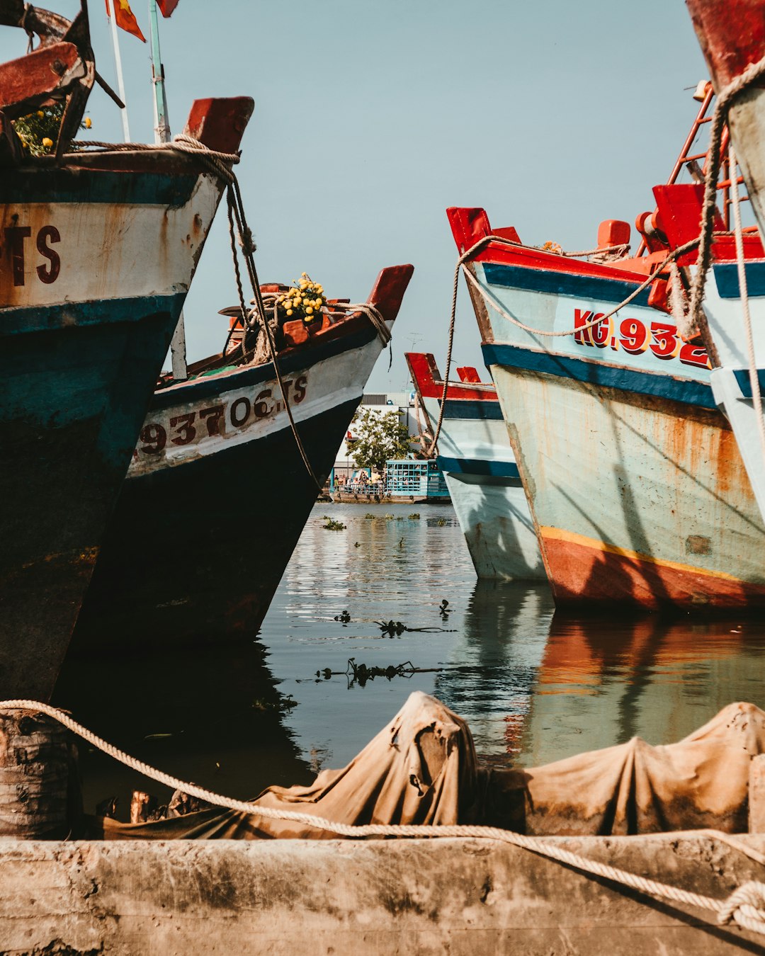 white and brown boat on water during daytime