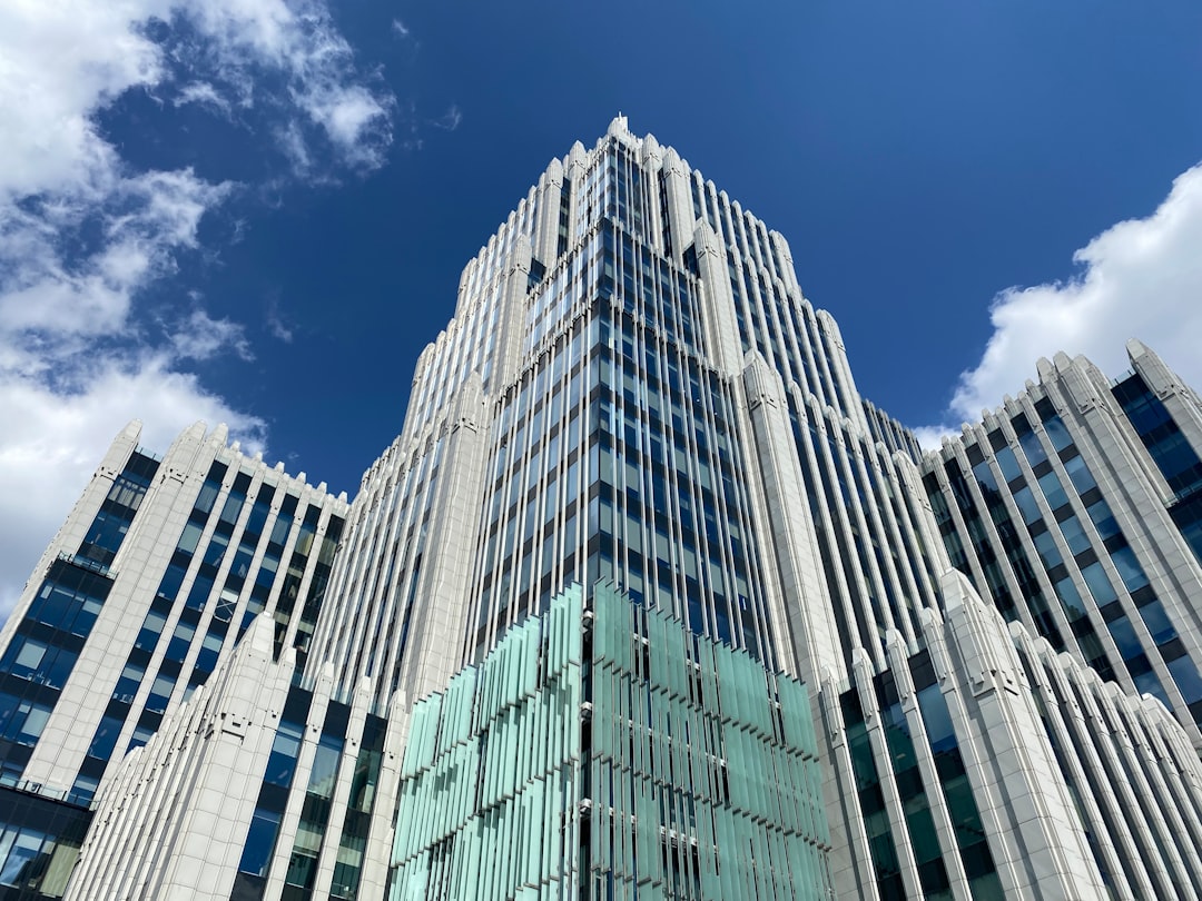 white and green concrete building under blue sky during daytime