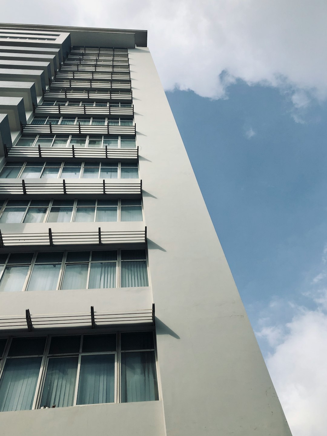 white concrete building under blue sky during daytime